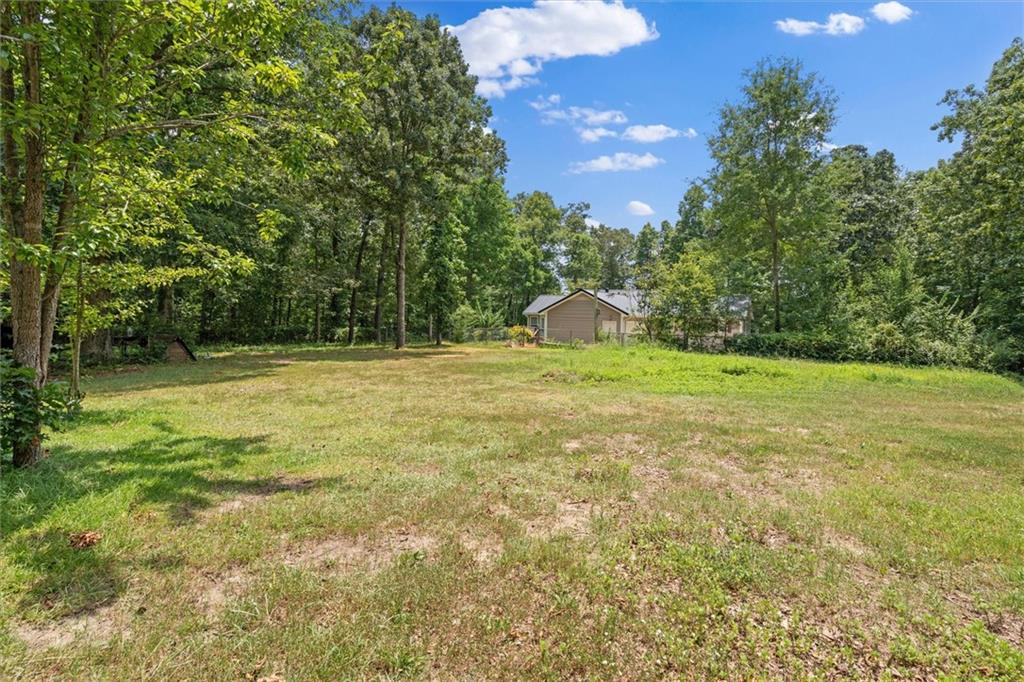 1267 Austin Bridge Road Douglasville, GA 30134 - Photo 61 of 66 a view of outdoor space with deck and yard