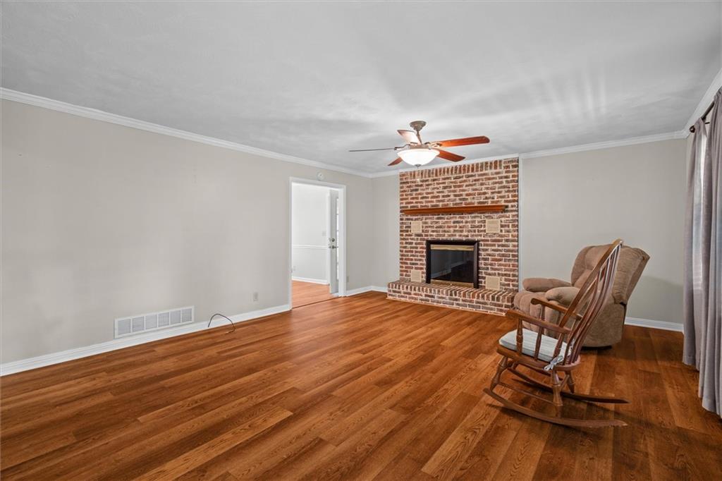1267 Austin Bridge Road Douglasville, GA 30134 - Photo 9 of 66 a view of a livingroom with furniture and a fireplace