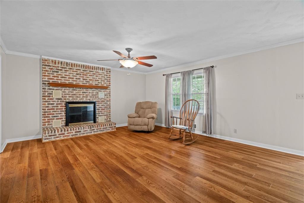 1267 Austin Bridge Road Douglasville, GA 30134 - Photo 10 of 66 a view of a livingroom with a fireplace and a window