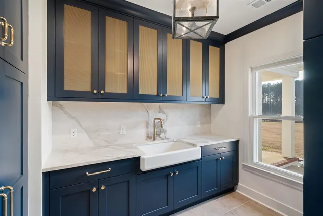 a view of empty room with wooden floor and fireplace