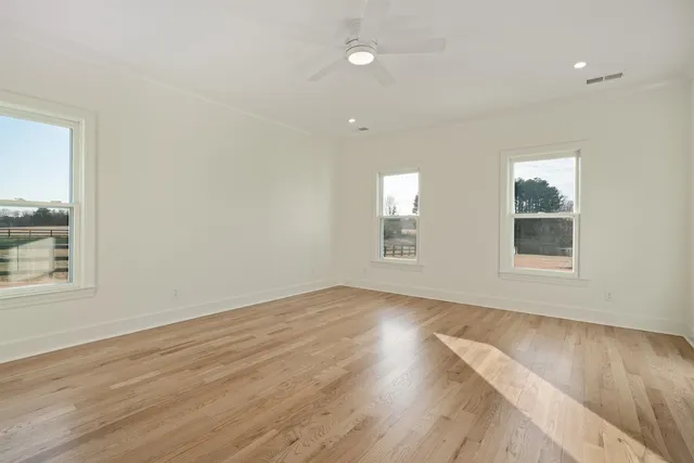 a bathroom with a granite countertop sink mirror and a bathtub