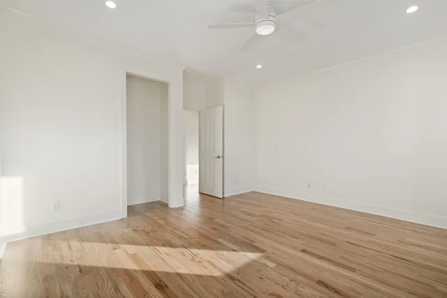 a bathroom with a granite countertop sink a toilet and shower