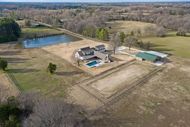 an aerial view of a house with outdoor space