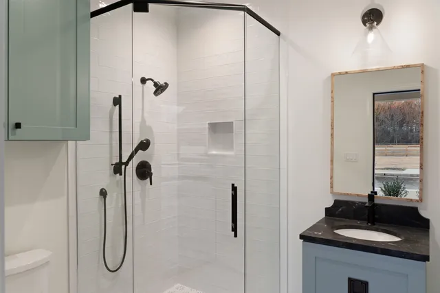 a front view of a house with yard and trees