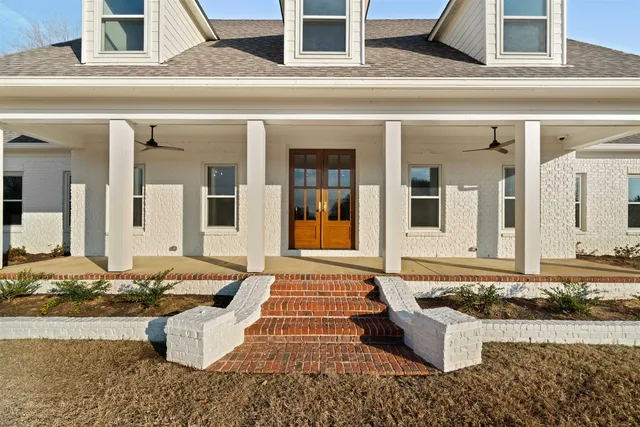a view of an entryway with wooden floor and stairs