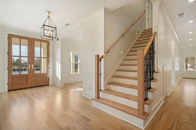 a view of a kitchen with a sink and a large window
