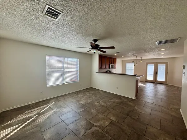 a view of a kitchen with a sink and a window