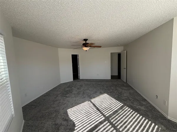 a view of a livingroom with a ceiling fan