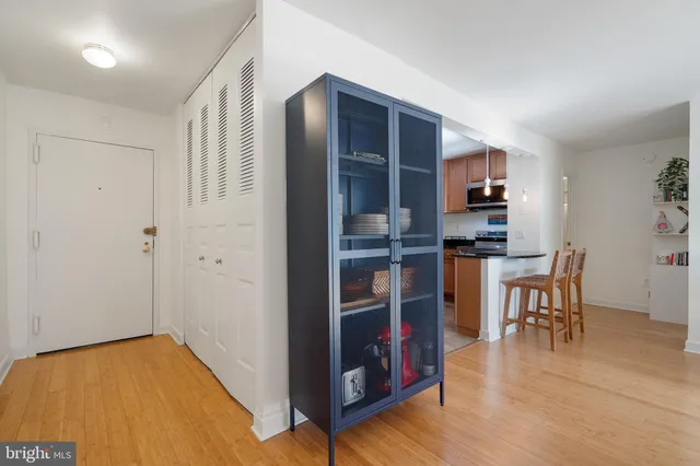 a view of kitchen and dining room with wooden floor