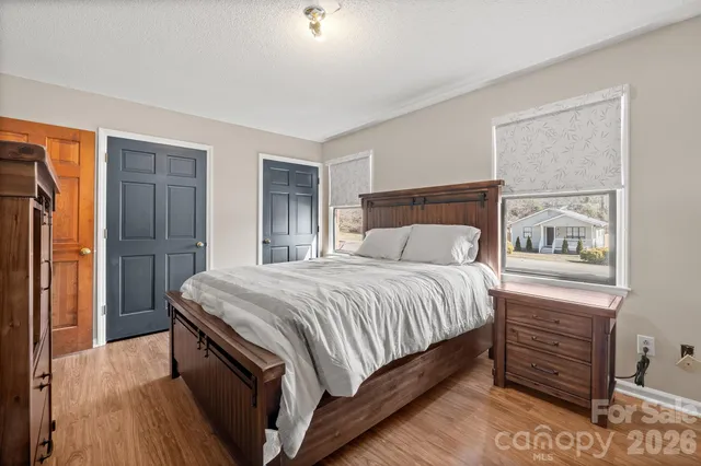 a bedroom with a bed and a closet