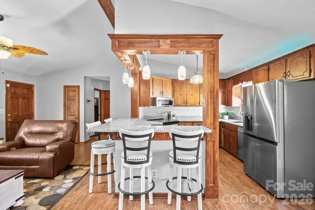 a dining room with furniture and a kitchen