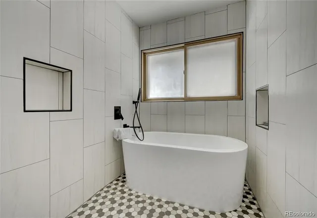 a white bath tub sitting in a bathroom