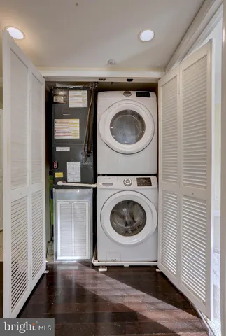 a utility room with sink dryer and washer