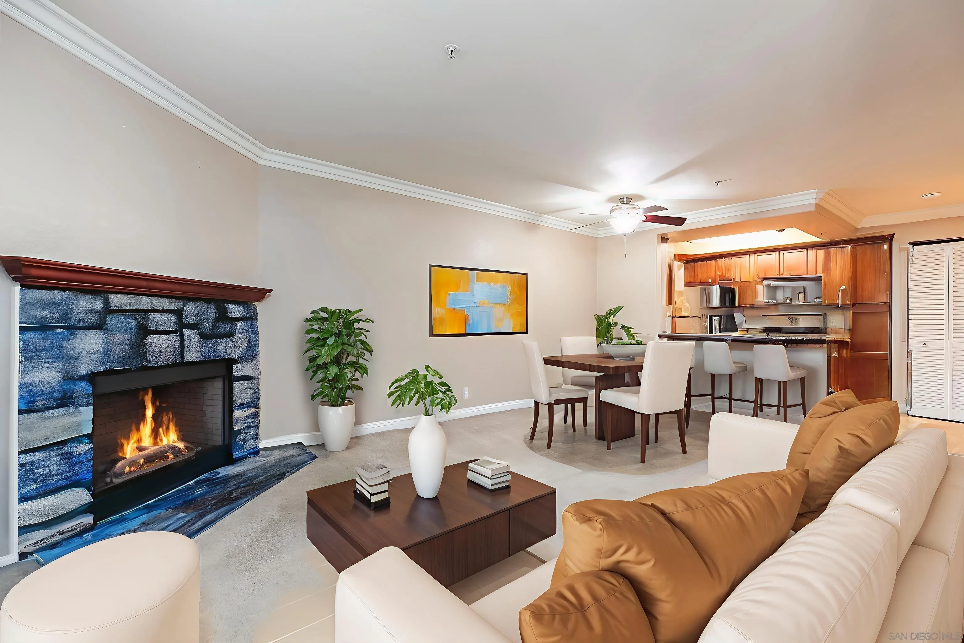 1434 Marshall Road, Unit 56 Alpine, CA 91901 - Photo 3 of 14 a living room with furniture a flat screen tv and a fireplace