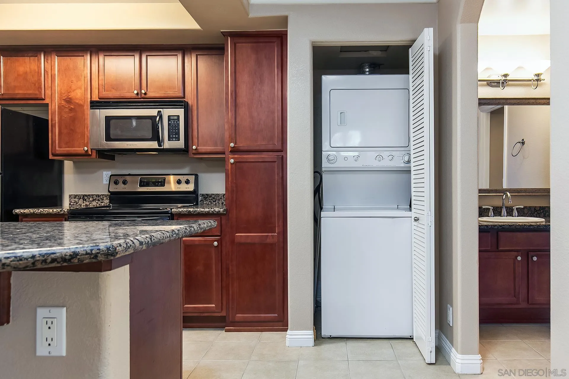 1434 Marshall Road, Unit 56 Alpine, CA 91901 - Photo 5 of 14 a kitchen with stainless steel appliances granite countertop a refrigerator and a stove top oven