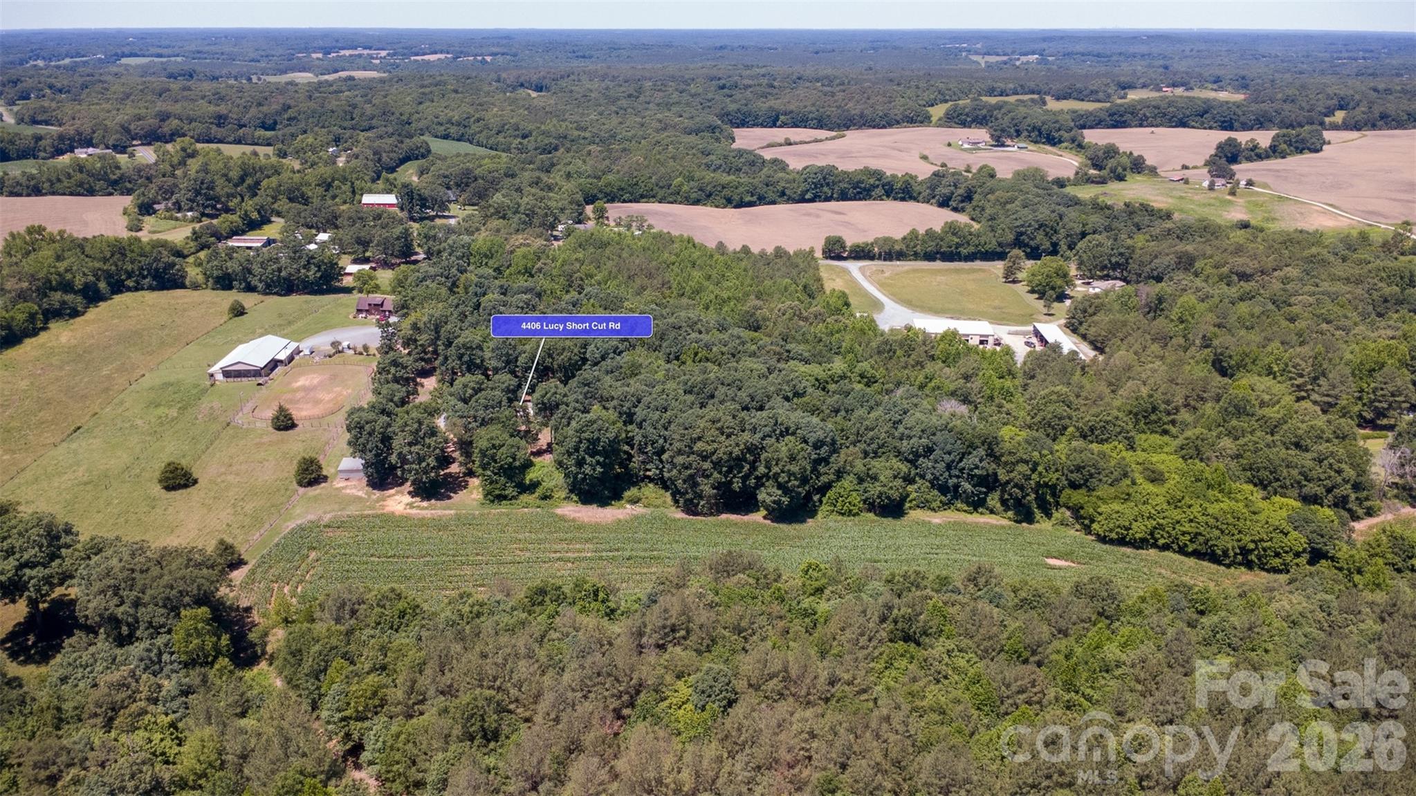 4406 Lucy Short Cut Road Marshville, NC 28103 - Photo 27 of 30 an aerial view of residential houses with outdoor space and trees