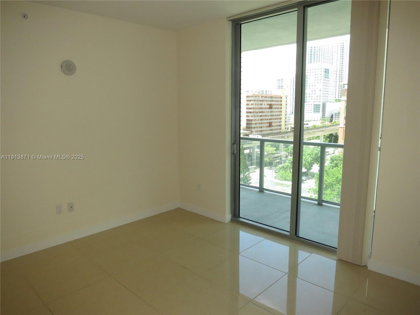 1111 Southwest 1st Avenue, Unit 1024N Miami, FL 33130 - Photo 10 of 12 a view of an empty room with a window