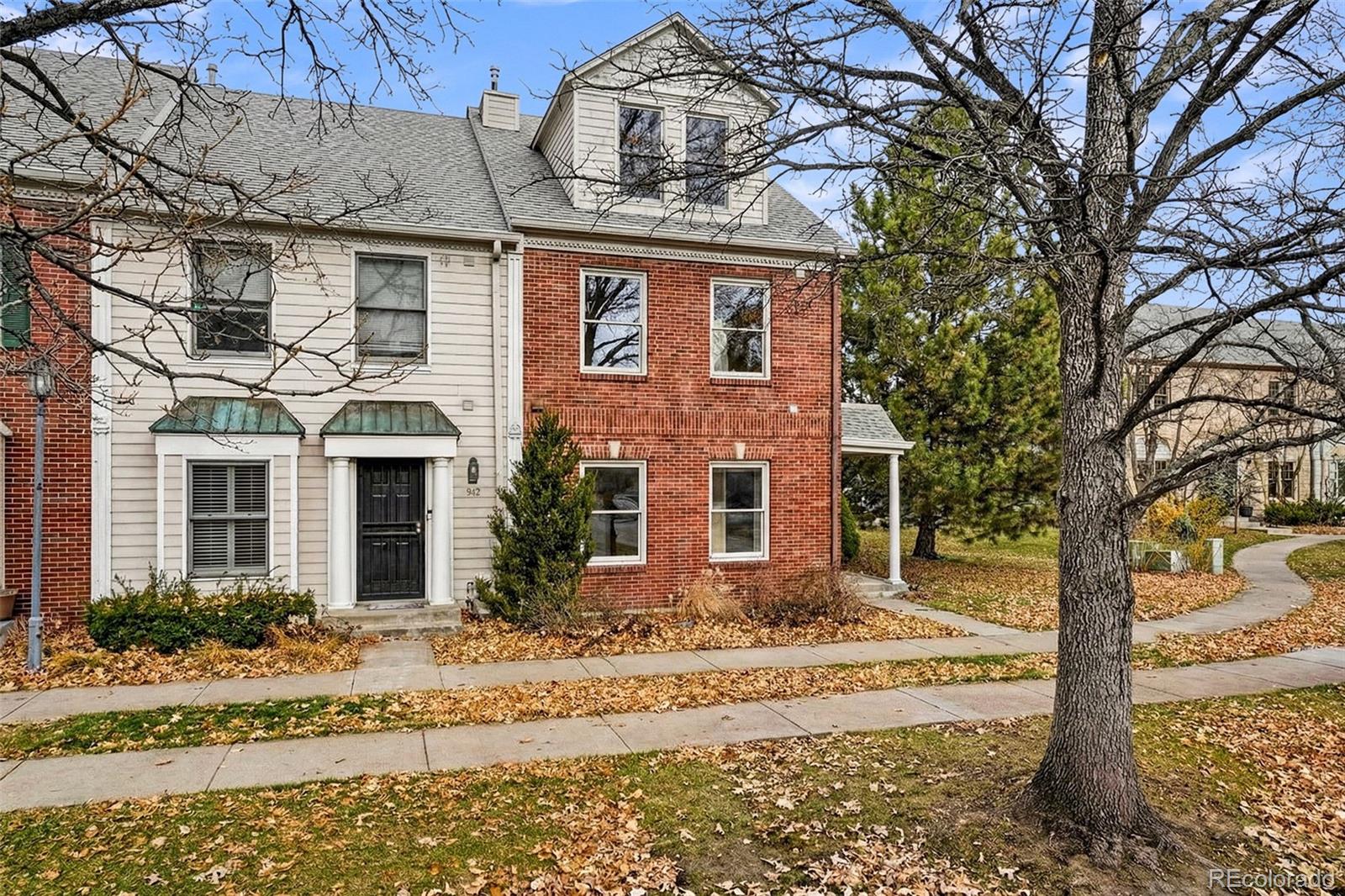 944 Ivanhoe Street Denver, CO 80220 - Photo 3 of 50 a front view of a house with a yard