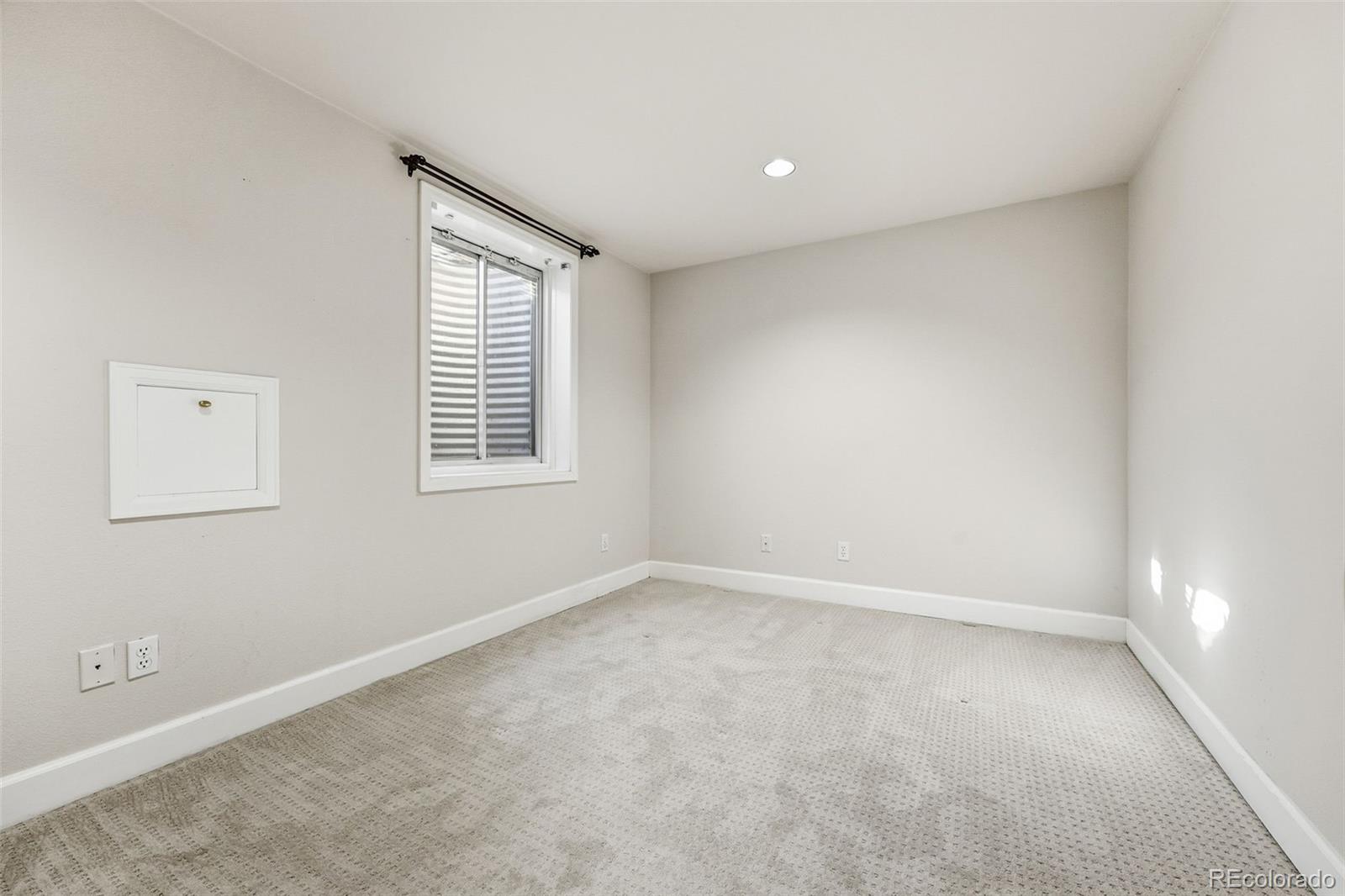 944 Ivanhoe Street Denver, CO 80220 - Photo 32 of 50 an empty room with windows