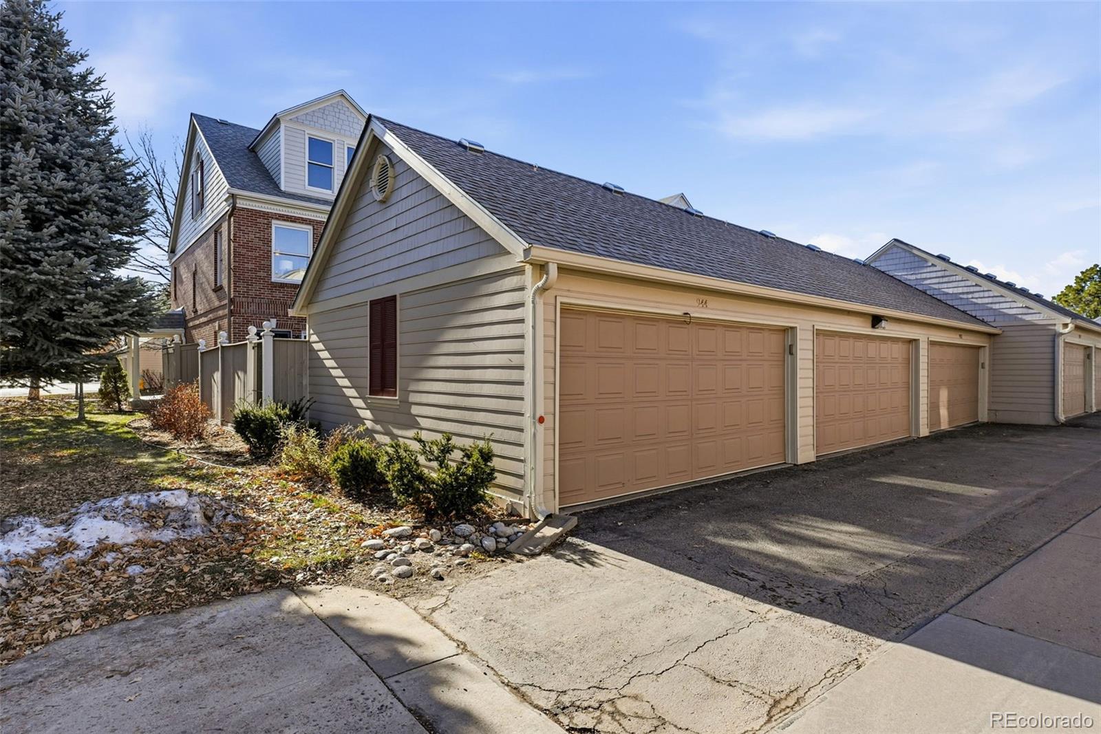 944 Ivanhoe Street Denver, CO 80220 - Photo 39 of 50 a front view of a house with garden