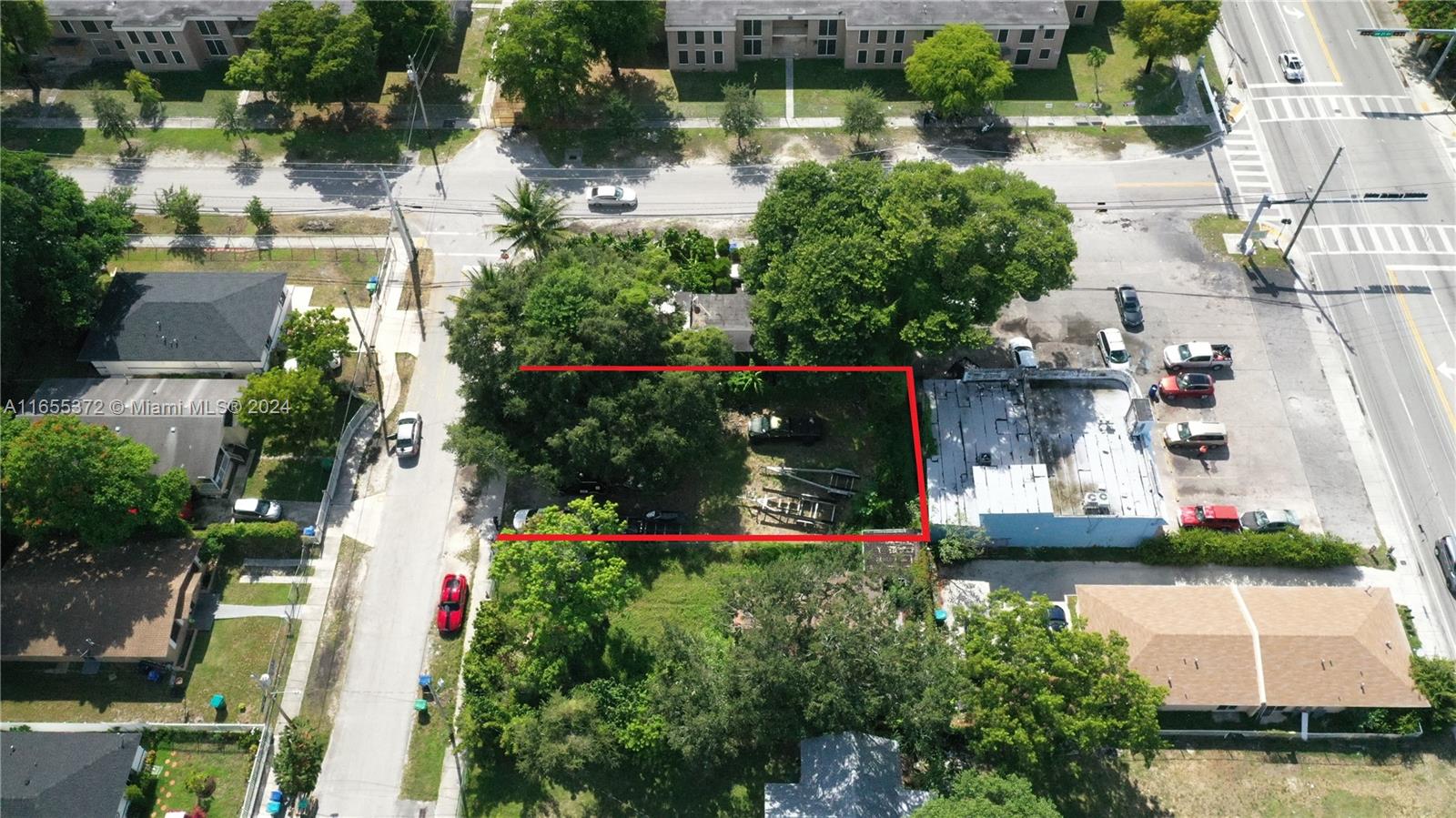 1975 Northwest 53rd Street Miami, FL 33142 - Photo 5 of 6 an aerial view of a house with a lake view