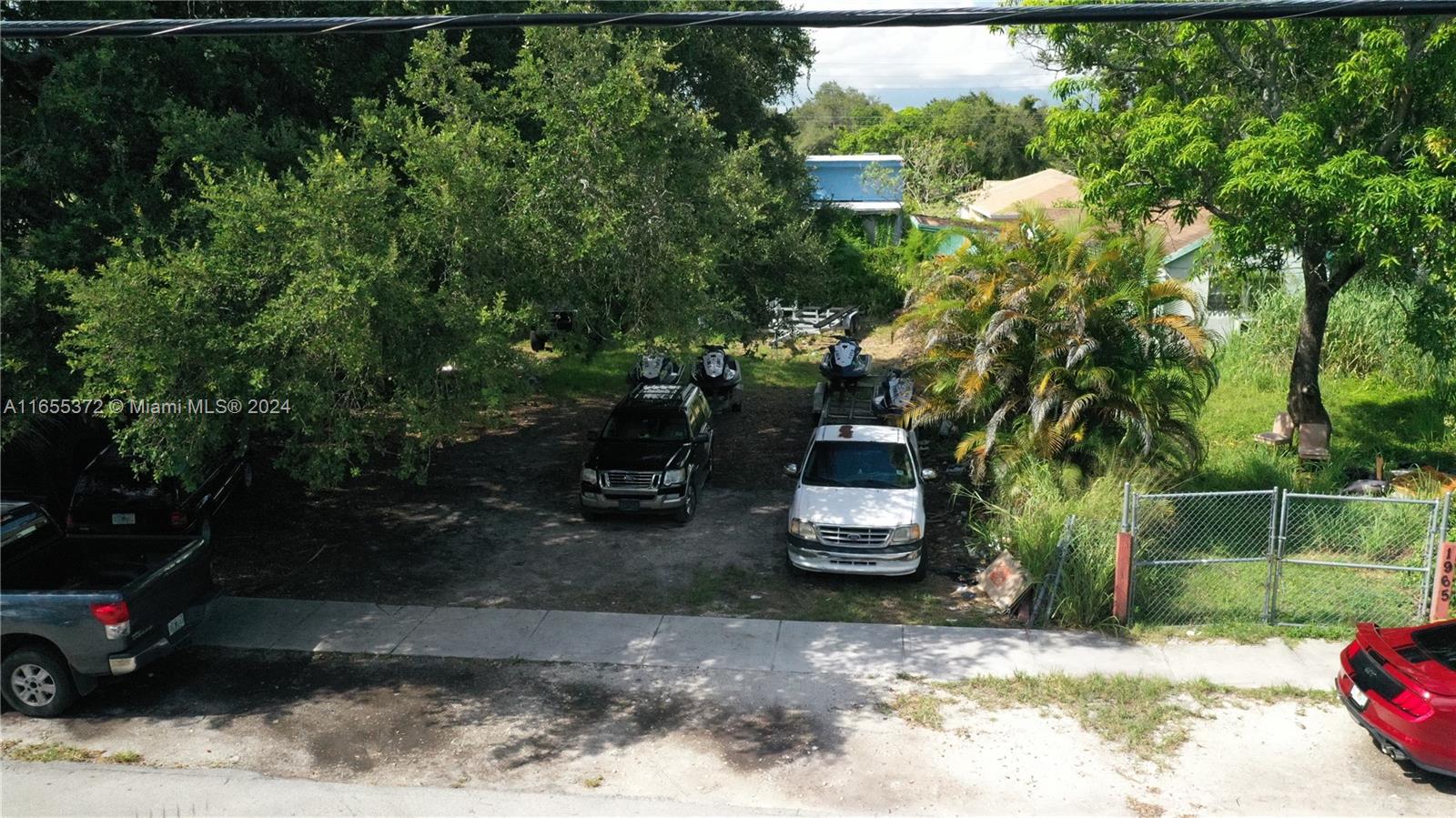 1975 Northwest 53rd Street Miami, FL 33142 - Photo 6 of 6 a view of a backyard with plants and a patio