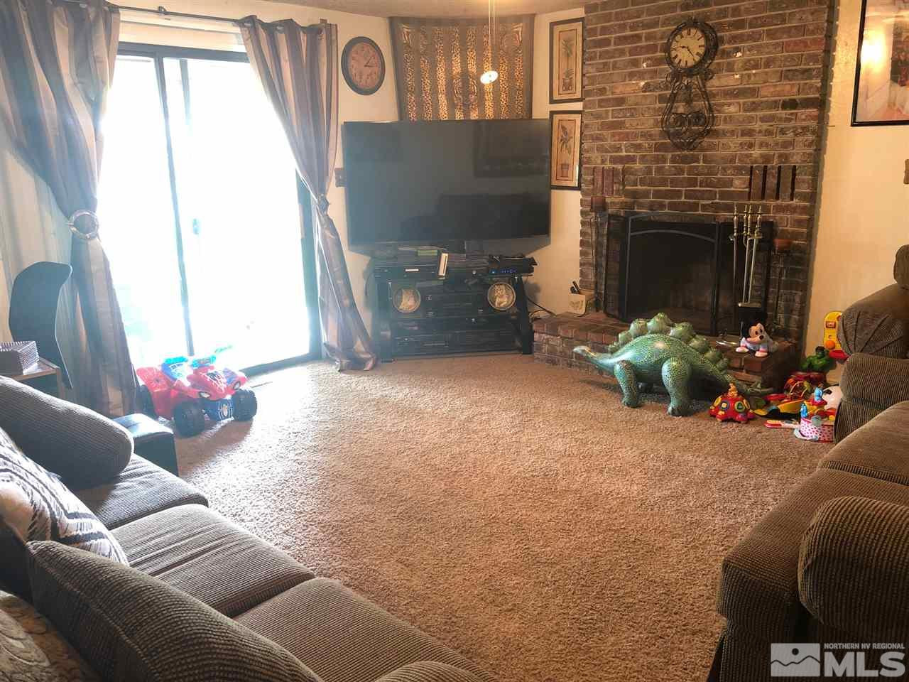 4200 Santa Maria Drive Reno, NV 89502 - Photo 6 of 14 a living room with furniture and a fireplace