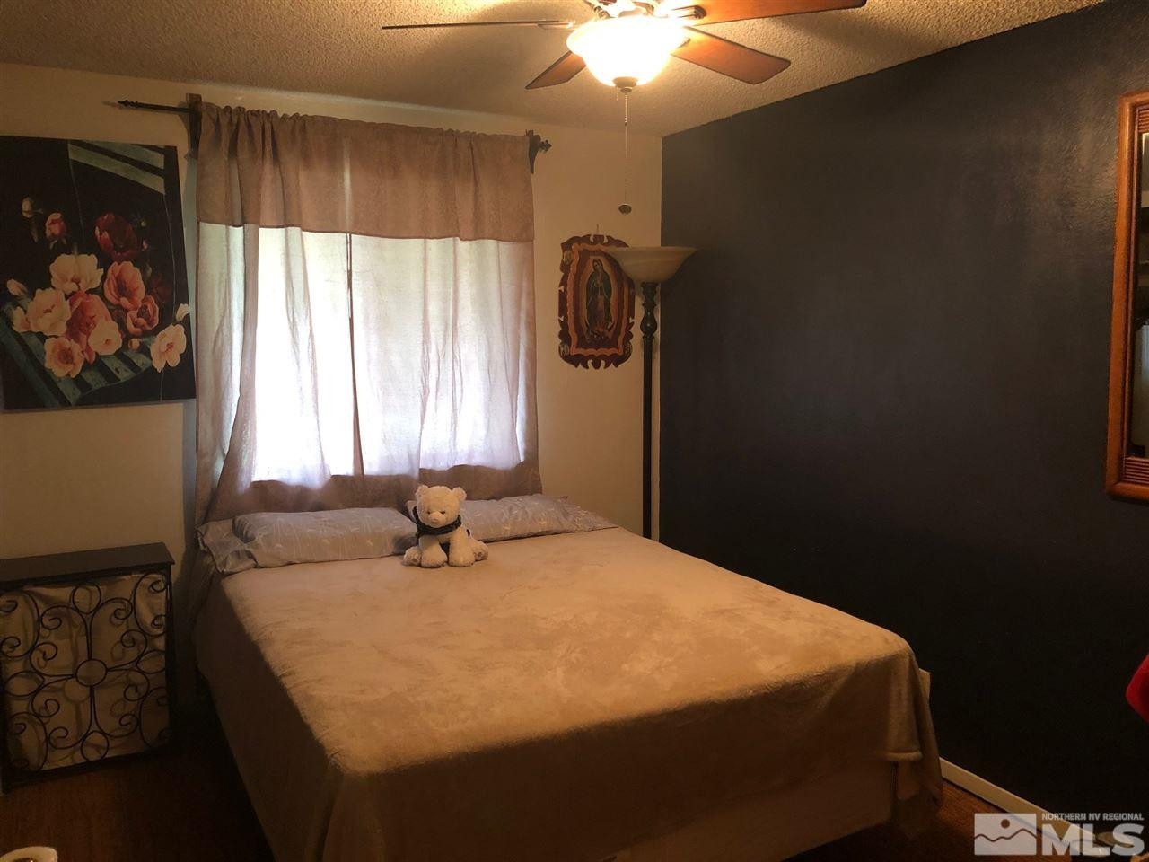 4200 Santa Maria Drive Reno, NV 89502 - Photo 10 of 14 a bedroom with a bed and a window
