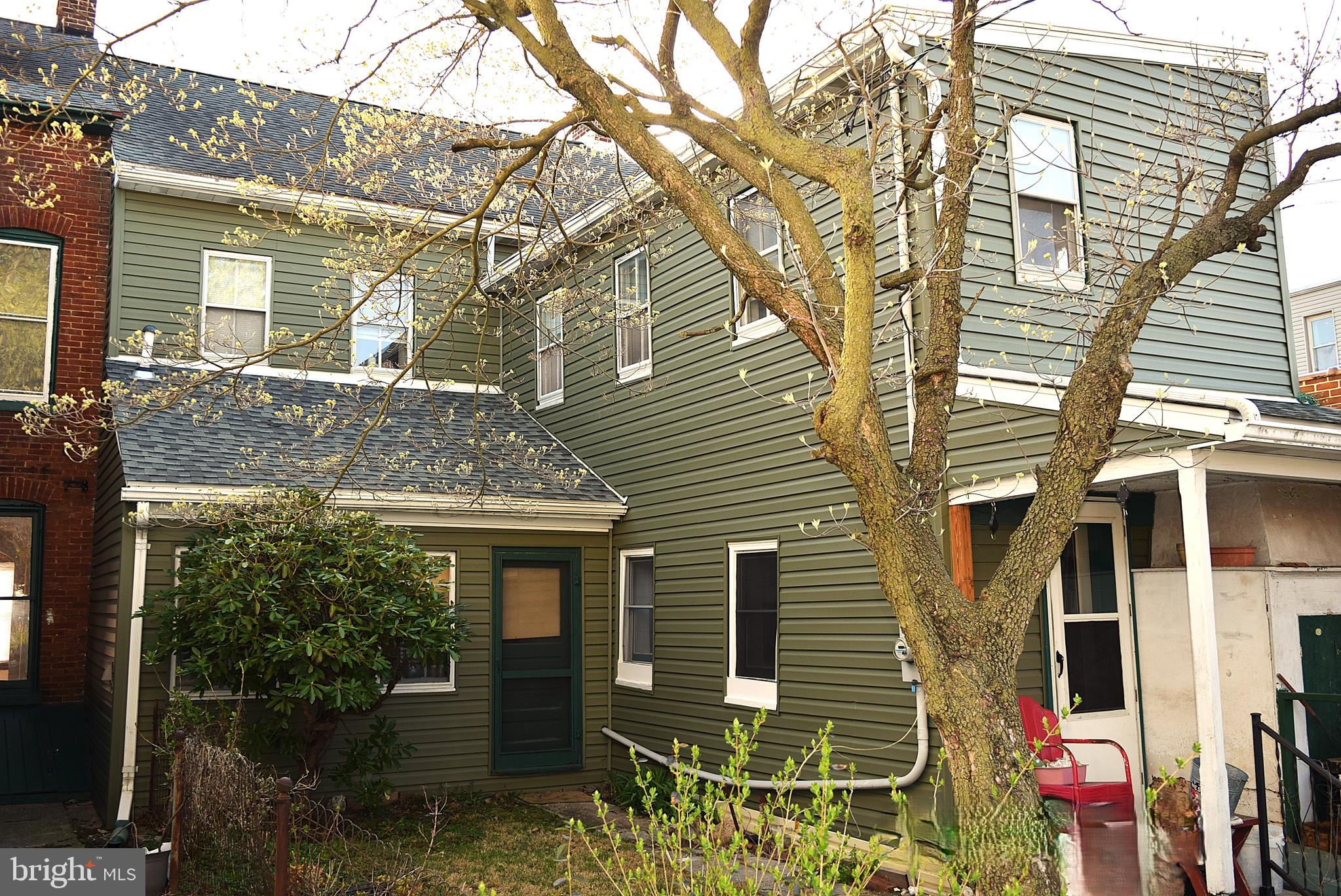 136 Baltimore Street Hanover, PA 17331 - Photo 2 of 6 a view of a house with a yard and wooden fence