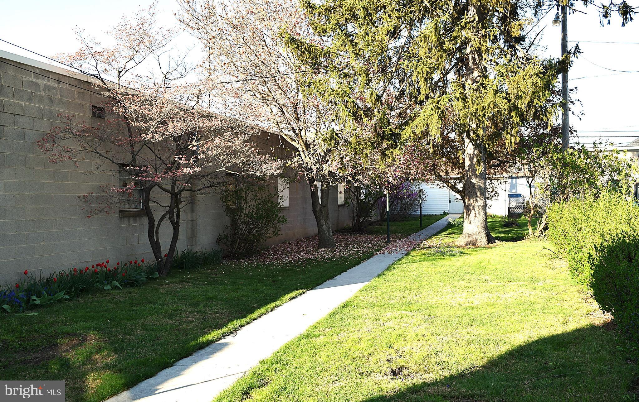 136 Baltimore Street Hanover, PA 17331 - Photo 3 of 6 a swimming pool with some trees in the background