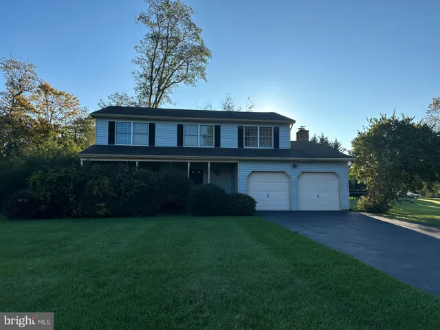 a view of a house with a yard and a table