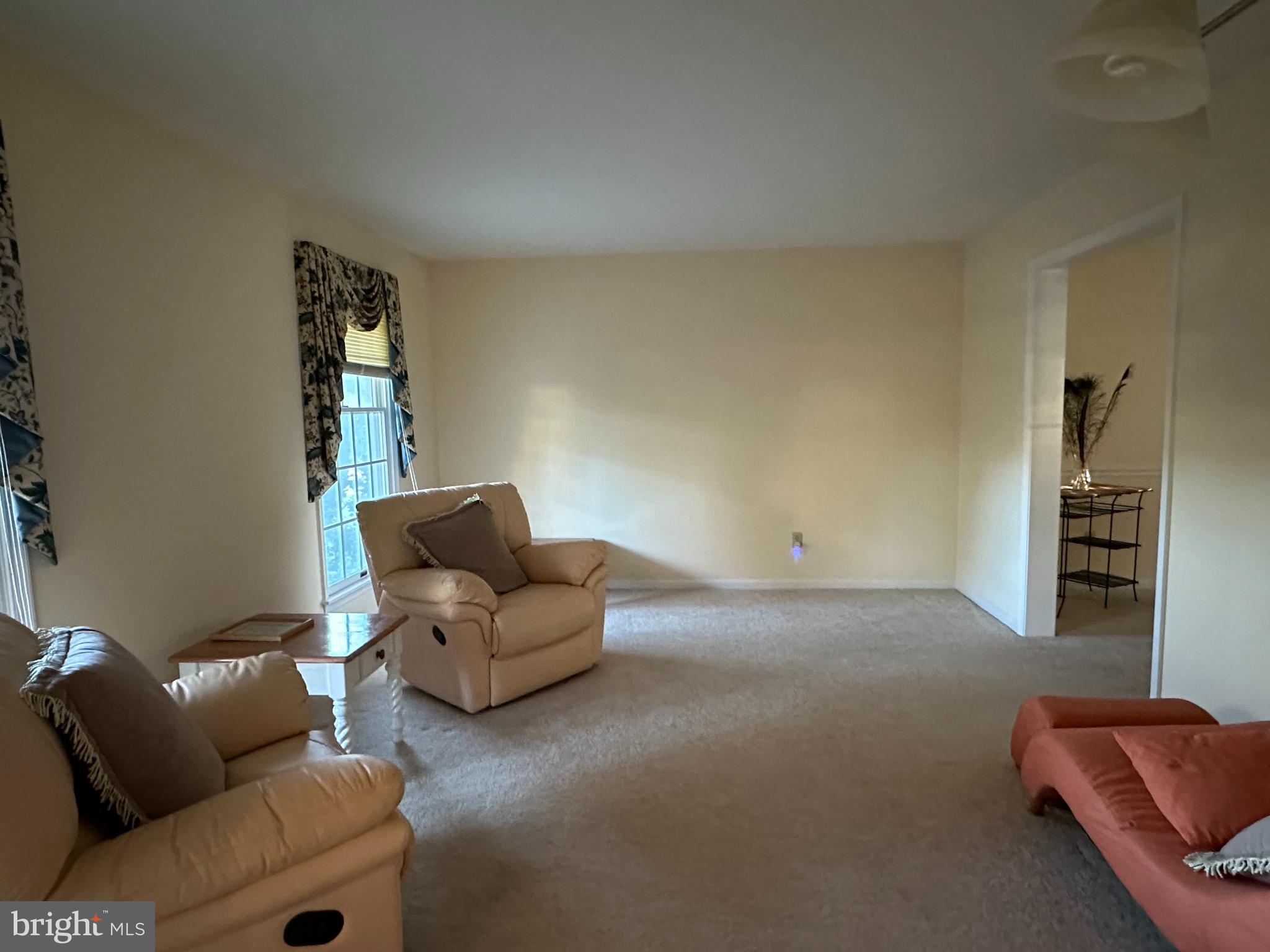 703 Lora Lane Hockessin, DE 19707 - Photo 13 of 28 a living room with furniture and a window