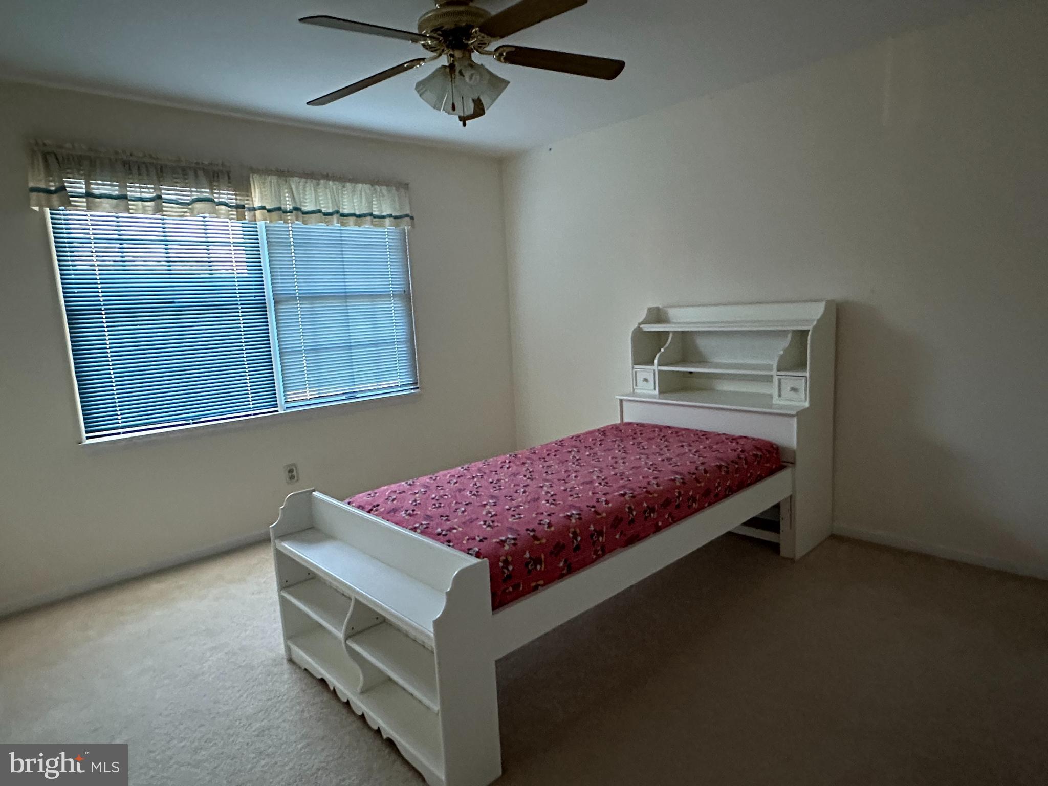 703 Lora Lane Hockessin, DE 19707 - Photo 22 of 28 a spacious bedroom with a bed and window