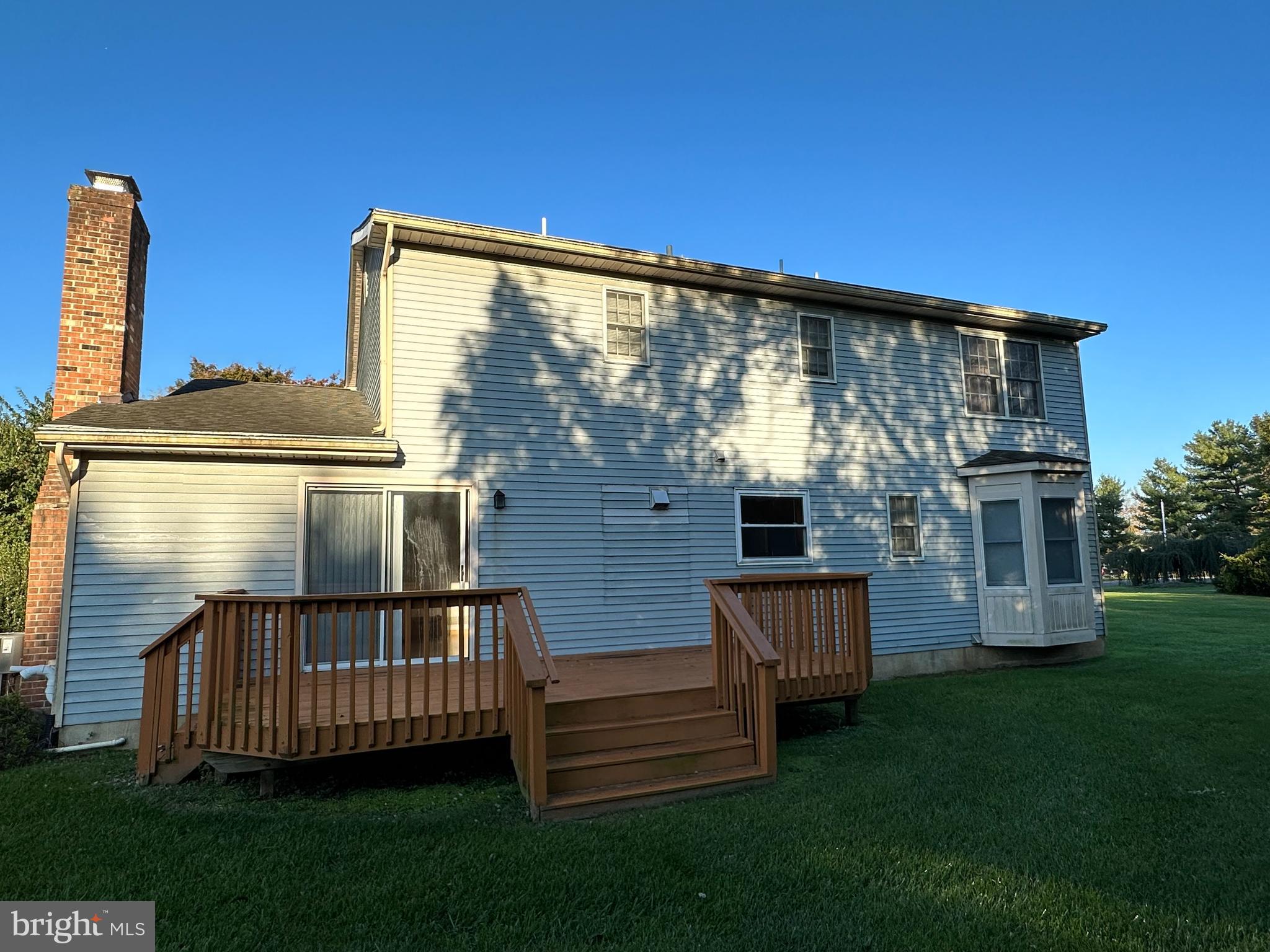 703 Lora Lane Hockessin, DE 19707 - Photo 25 of 28 a view of a house with backyard and porch