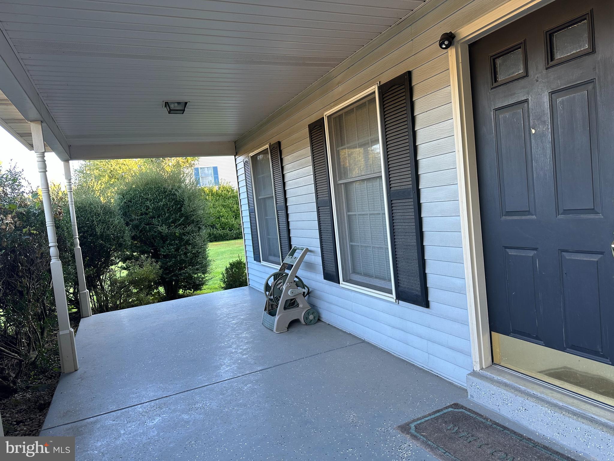 703 Lora Lane Hockessin, DE 19707 - Photo 3 of 28 a view of a room with porch and wooden floor