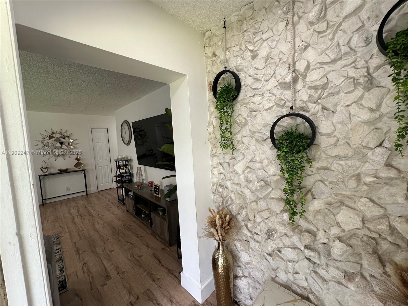 6040 Southwest 35th Street, Unit 2 Miramar, FL 33023 - Photo 5 of 14 a view of entryway with wooden floor