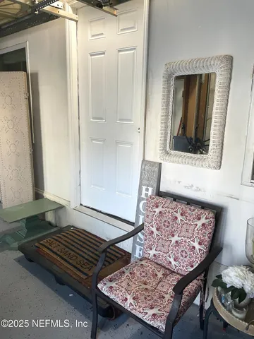 a living room with a rug and a rug