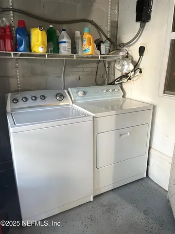 a utility room with dryer and washer