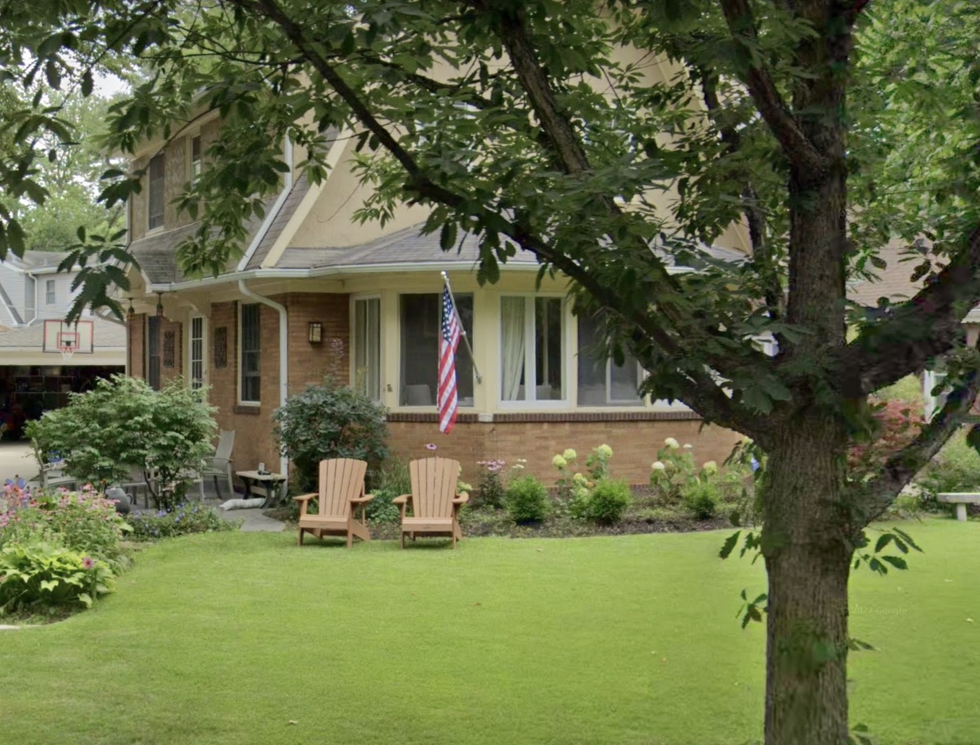 145 North Delaplaine Road Riverside, IL 60546 - Photo 1 of 1 a front view of a house with garden