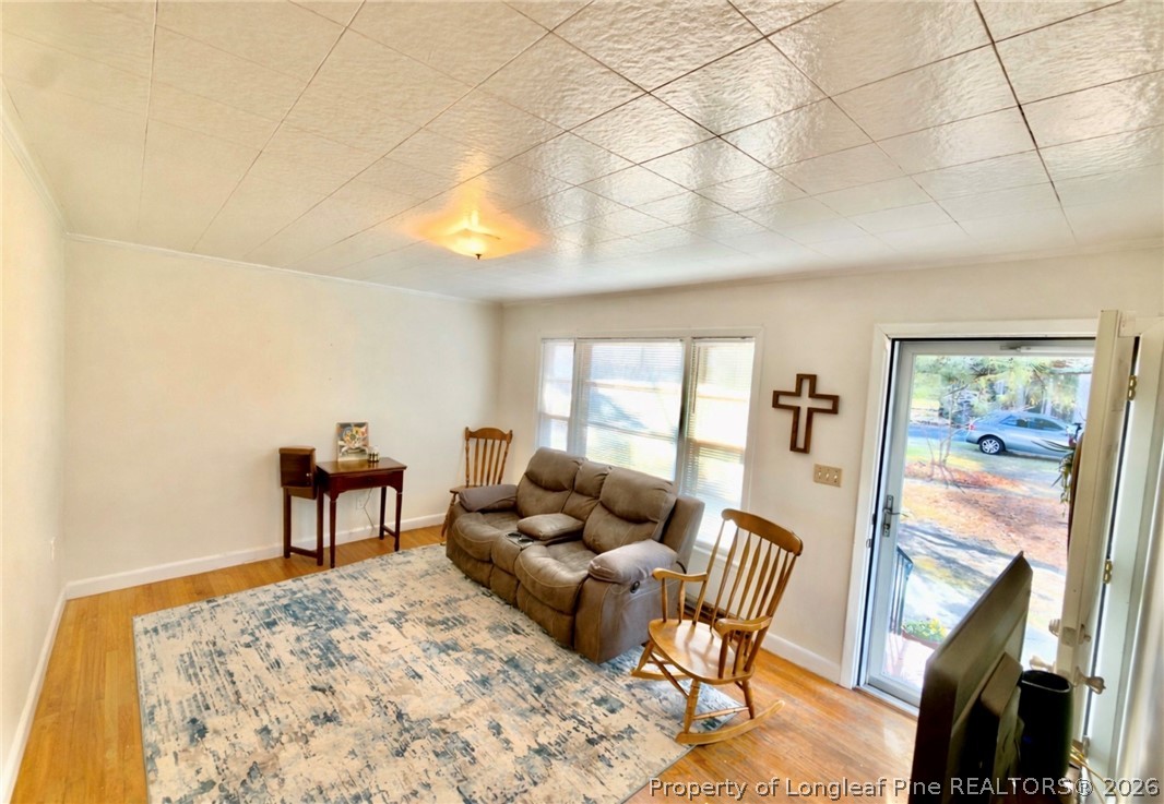 5271 Tobacco Road Orrum, NC 28369 - Photo 14 of 49 a living room with furniture and a flat screen tv