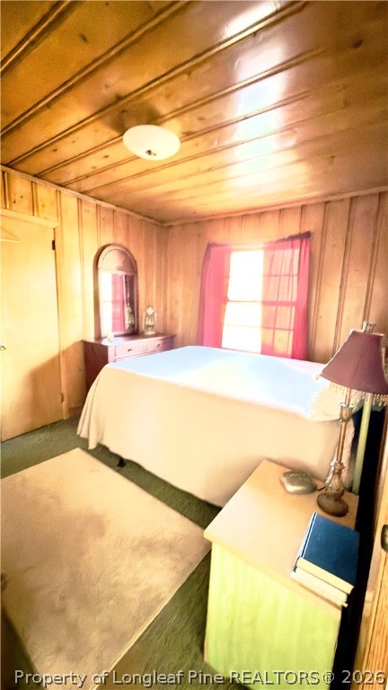 5271 Tobacco Road Orrum, NC 28369 - Photo 16 of 49 a bedroom with a bed and a night stand