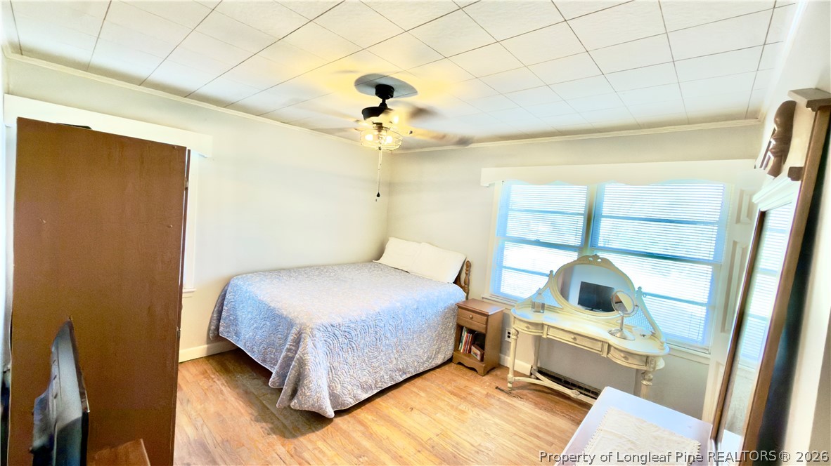 5271 Tobacco Road Orrum, NC 28369 - Photo 19 of 49 a bedroom with a bed and a window