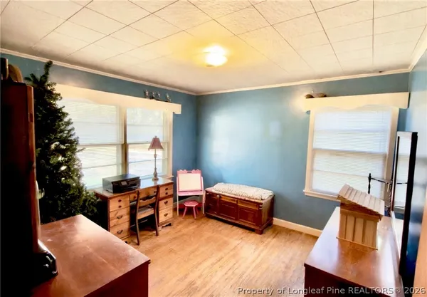 a bedroom with bed and window