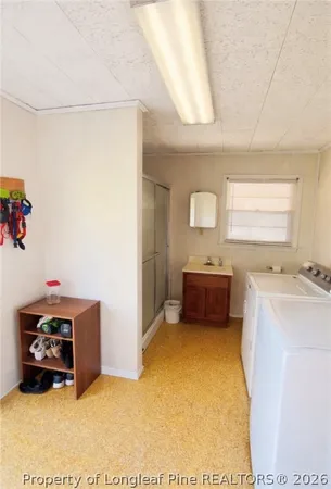 a bathroom with a shower and a bath tub