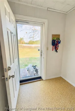 an aerial view of a house with a yard and a garden