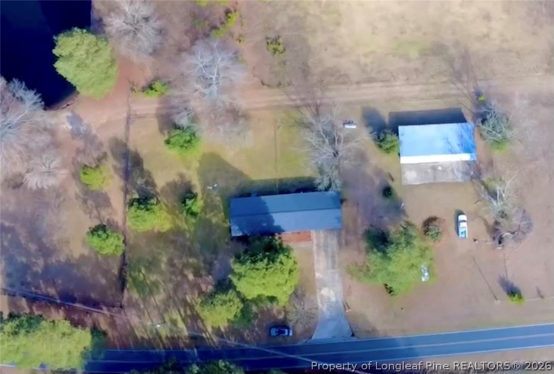 5271 Tobacco Road Orrum, NC 28369 - Photo 31 of 49 an aerial view of a house with a yard and a garden