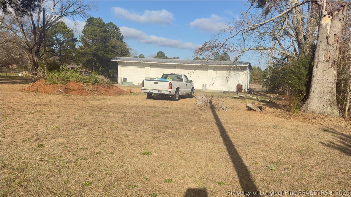 5271 Tobacco Road Orrum, NC 28369 - Photo 33 of 49 a view of a house with backyard of the house