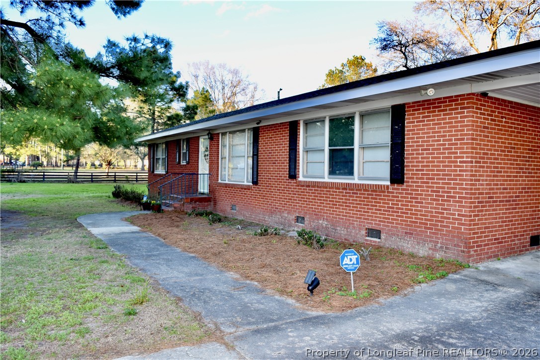 5271 Tobacco Road Orrum, NC 28369 - Photo 34 of 49 a front view of a house with garden