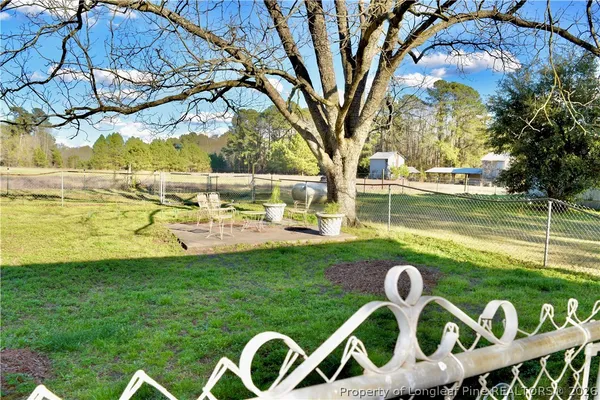 a view of yard with swimming pool