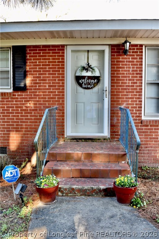 5271 Tobacco Road Orrum, NC 28369 - Photo 37 of 49 a front view of a house with outdoor seating and flowers